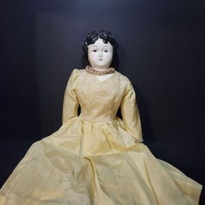 Antique Porcelain Doll with Yellow Dress